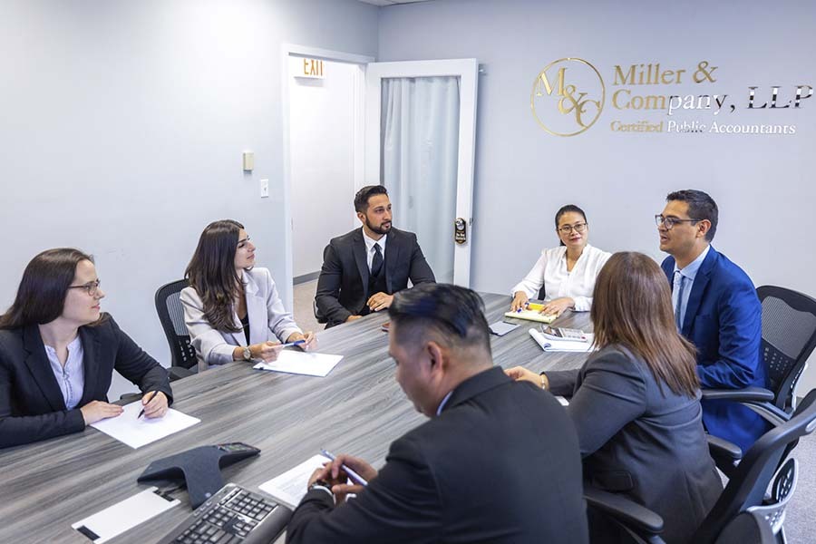 NYC CPA firm business consulting team meeting discussing financial strategy and growth planning with clients