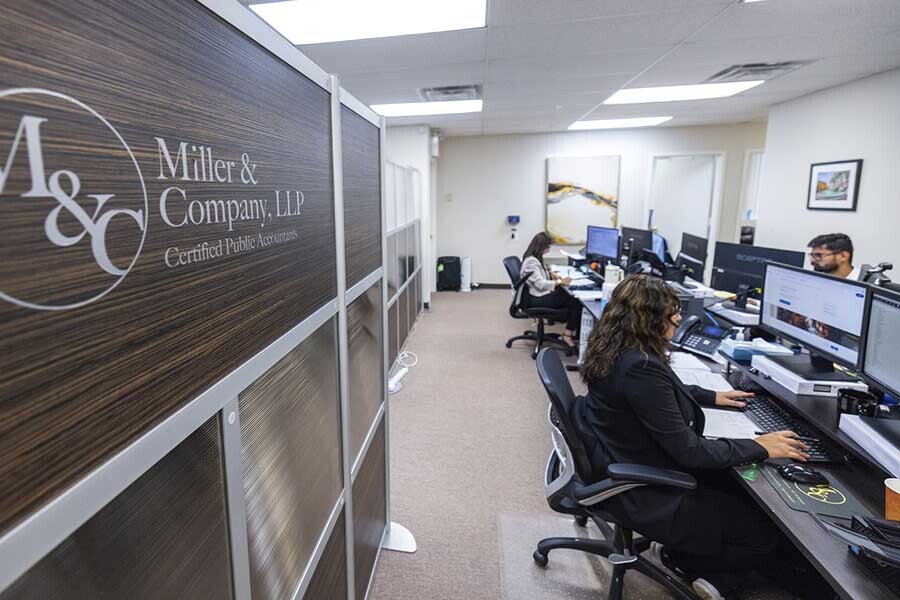 NYC CPA firm team working on financial planning analysis and business strategy development at Miller & Company LLP