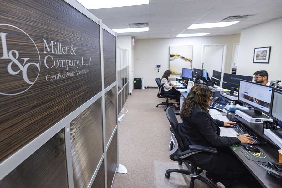 NYC CPA firm team preparing audited financial statements and financial reports in Manhattan office