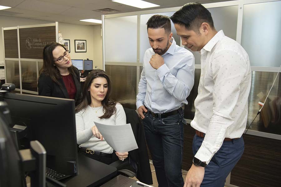 NYC CPA team preparing financial documents and IRS offer in compromise case for tax debt resolution