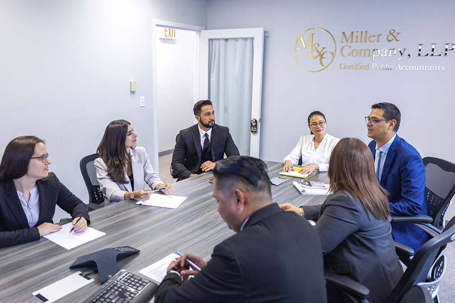 CPA tax specialists consulting clients about IRS tax levy relief and asset protection in New York office