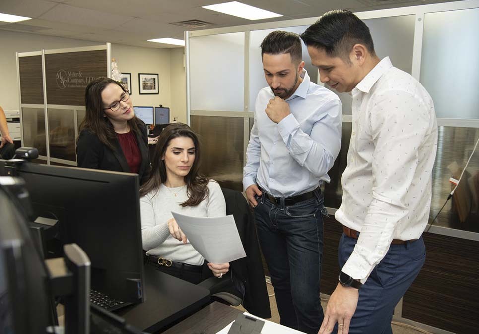 Miller & Company CPA team discussing financial statement review and compilation services