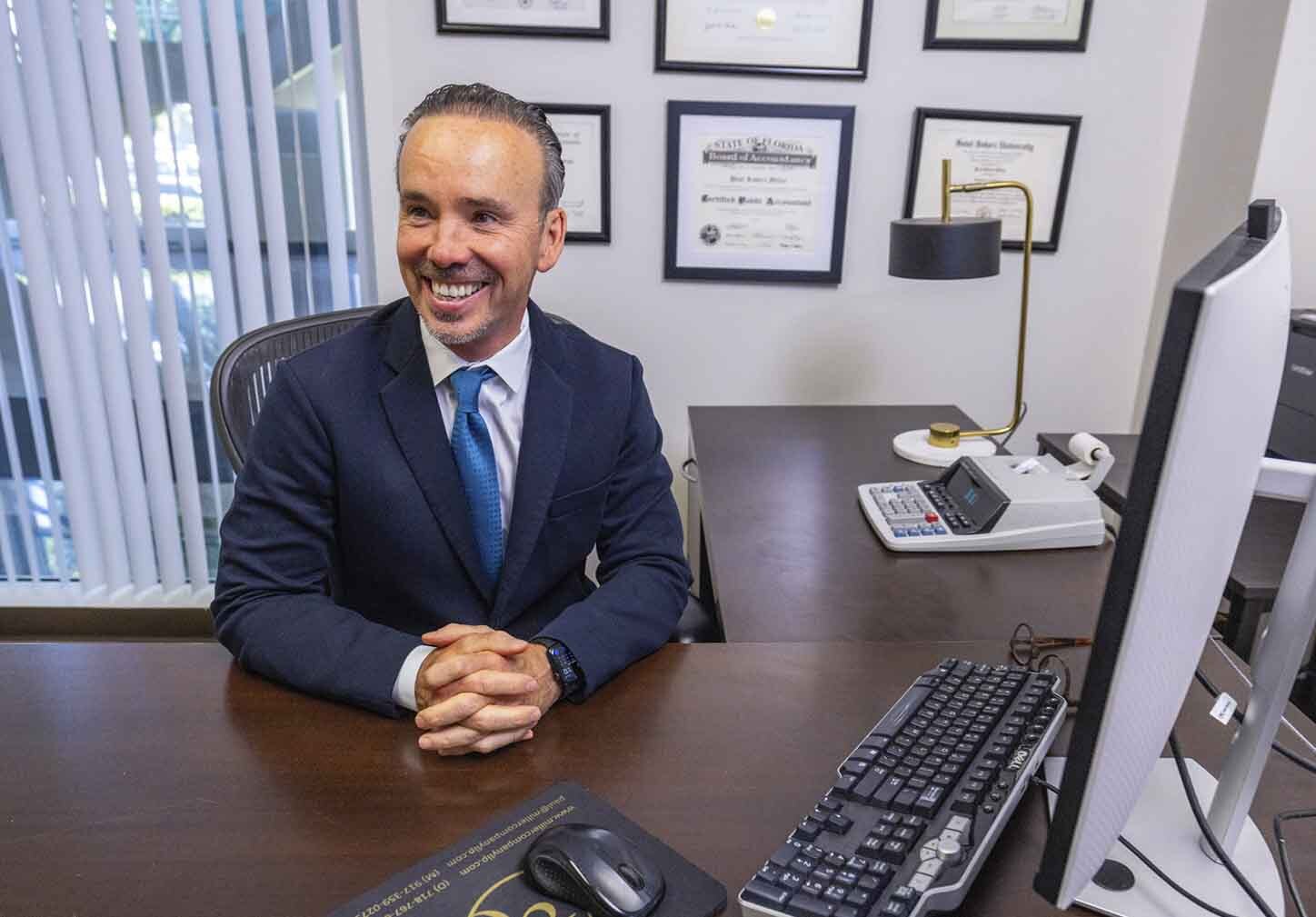 Crypto tax accountant reviewing digital asset transactions and tax reporting with a client